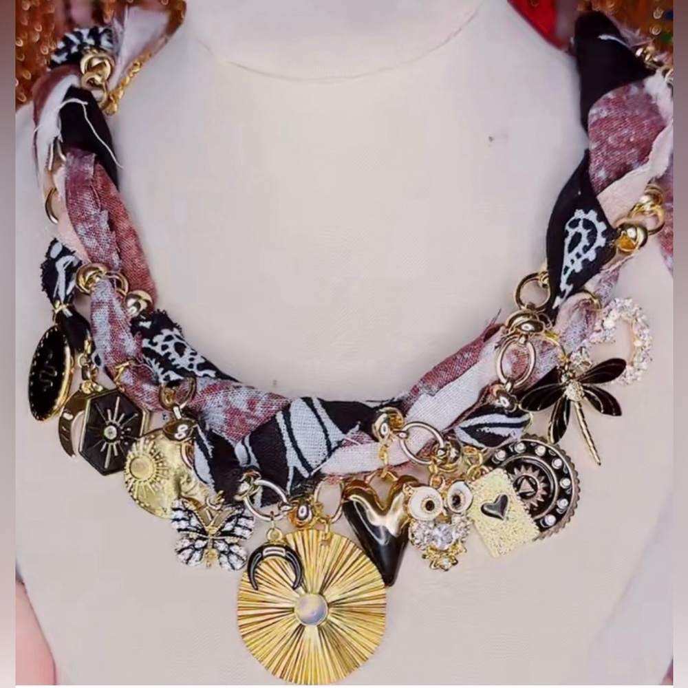 New. Never worn. Handmade Gold and Black Charm Necklace